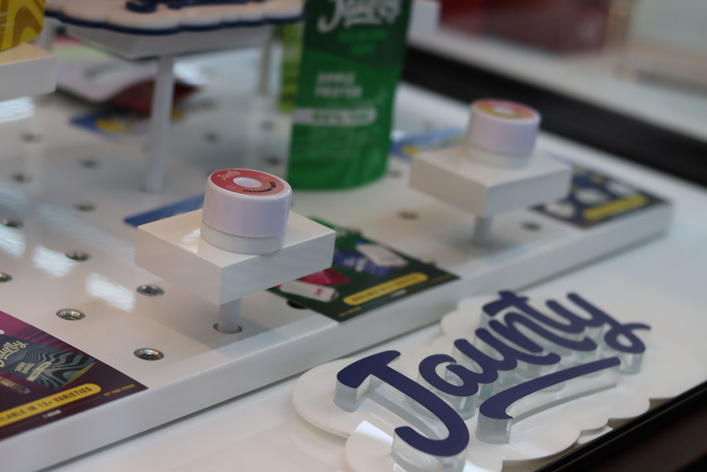 Jaunty cannabis oil vape cart sitting on a dispensary display desk